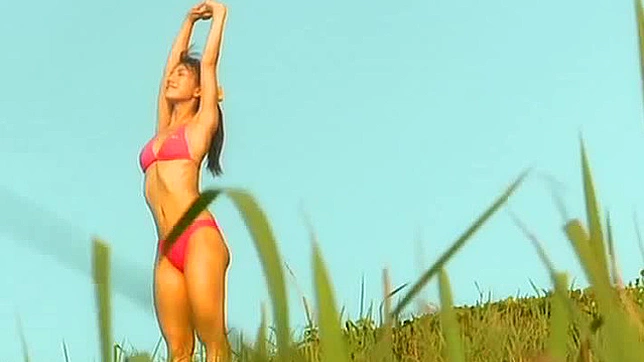 Lovely Aki Takajo posing in a pink bikini