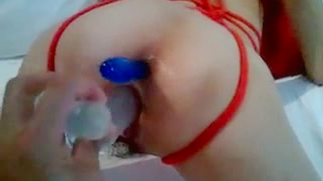 Japanese girl getting her asshole toyed in the bed