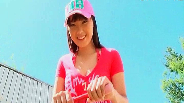 Busty and daring asian model is posing her body outdoors