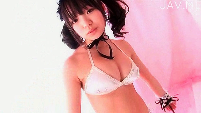 Pigtailed and glorious girl in bra is posing her sexy figure
