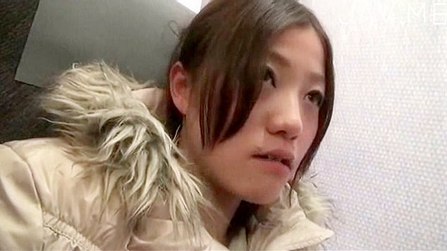 Nice looking japanese teen is walking alone outdoors