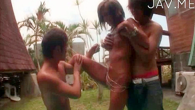 Good looking asian bimbo is having threesome fuck outdoors