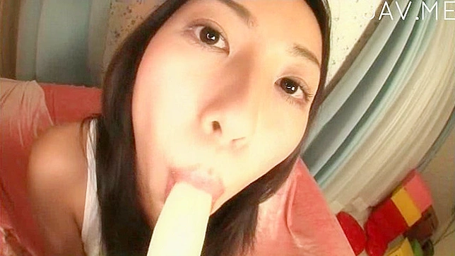 Horny brunette sucks a banana