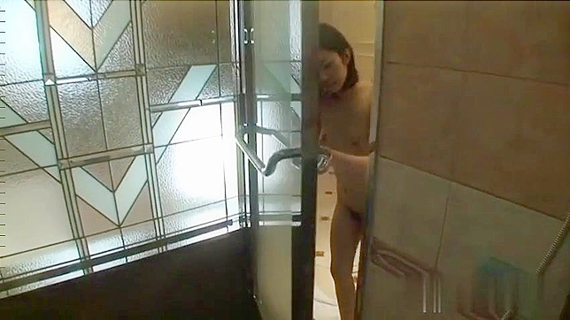 Naughty Japanese ten with long legs and small tits is playing in the bathtub