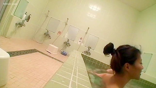 Peeping Tom Gets Lucky with Nude Japanese Beauty in Public Shower!